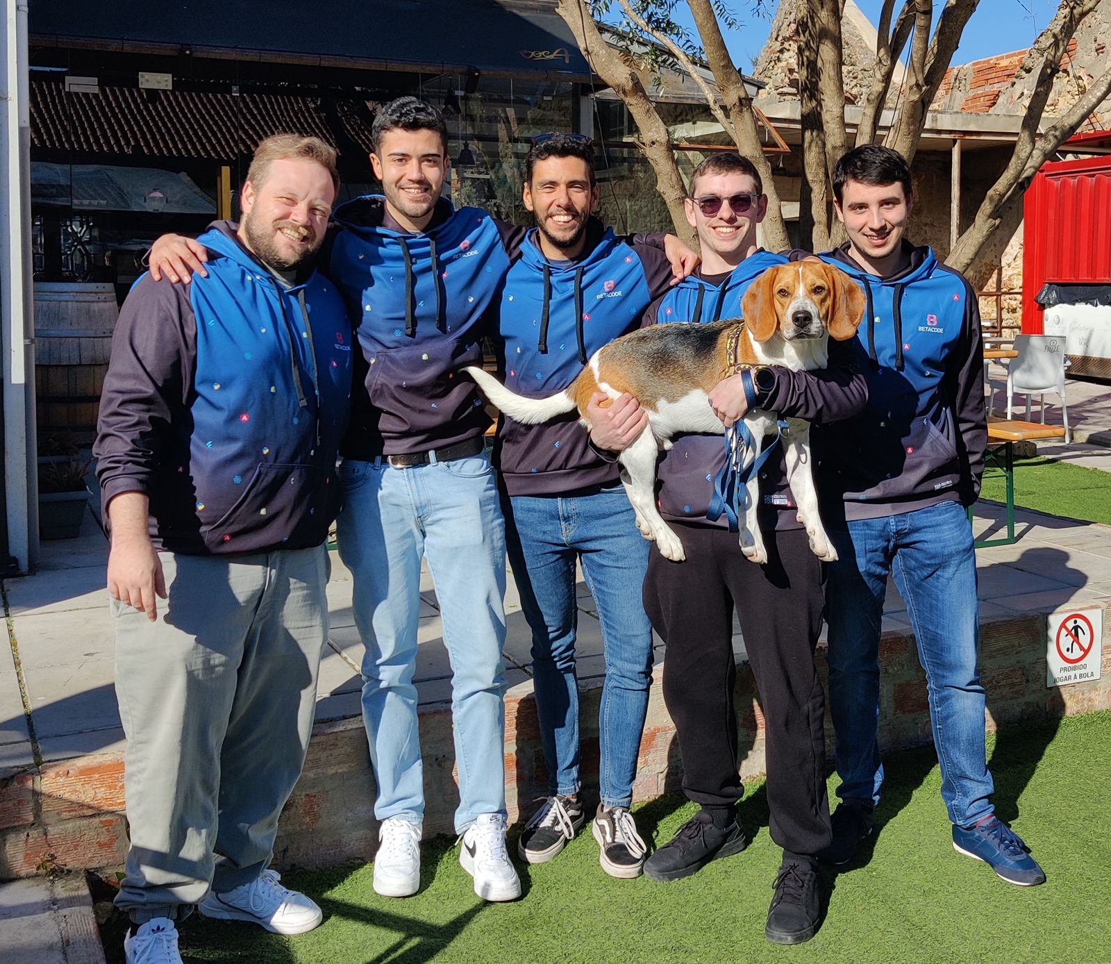 The Betacode team in hoodies, with the team dog